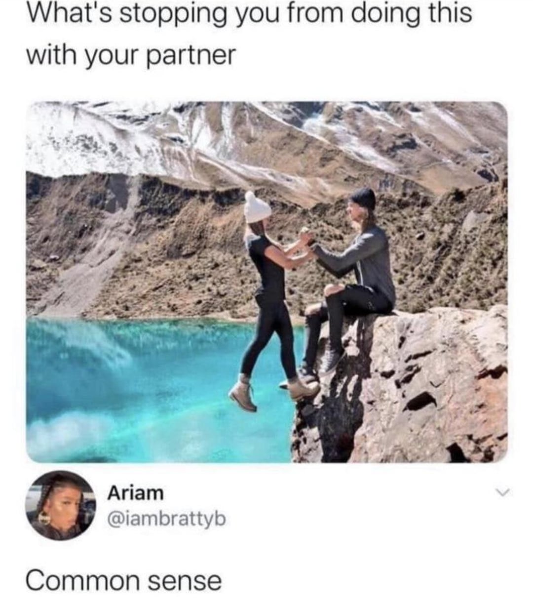 Two people sit on the edge of a cliff above a turquoise lake, holding hands. The caption asks, "What's stopping you from doing this with your partner?" Below, a comment reads, "Common sense.