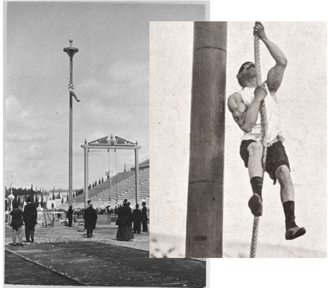A vintage photo shows a man climbing a tall rope while others watch in an outdoor stadium setting, possibly during an early 20th-century athletic event.