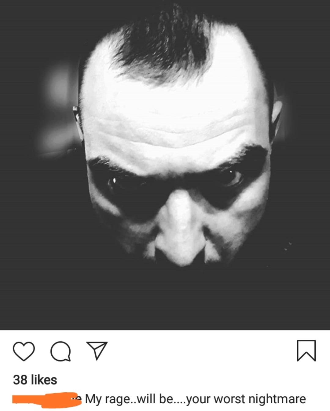 A black-and-white close-up photo of a man’s face looking up with a serious, intense expression. The caption below reads, "My rage..will be....your worst nightmare." Instagram interface is visible.