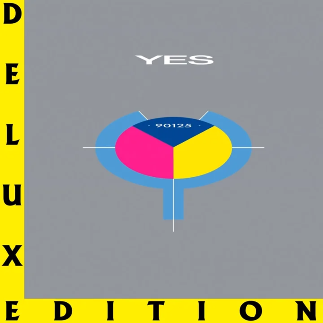 Album cover for "90125" by Yes, featuring a gray background with a colorful circular graphic in blue, pink, and yellow. "YES" is written above, and "DELUXE EDITION" appears vertically in yellow and black on the sides.