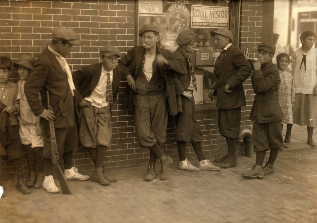 A group of men standing outside a building