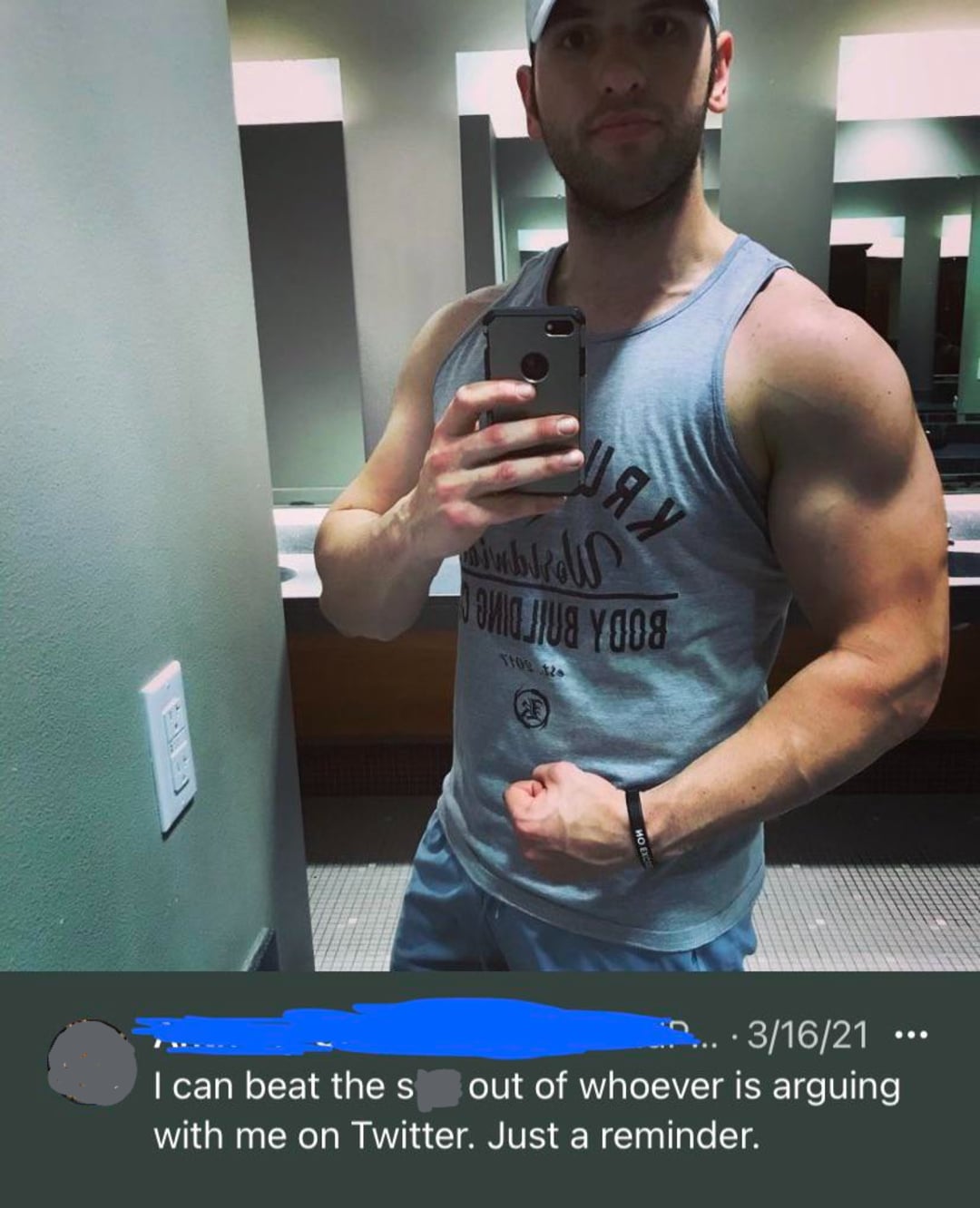 A muscular man in a gym tank top takes a flexing selfie in a bathroom mirror. Below, a social media post reads, “I can beat the s*** out of whoever is arguing with me on Twitter. Just a reminder.”