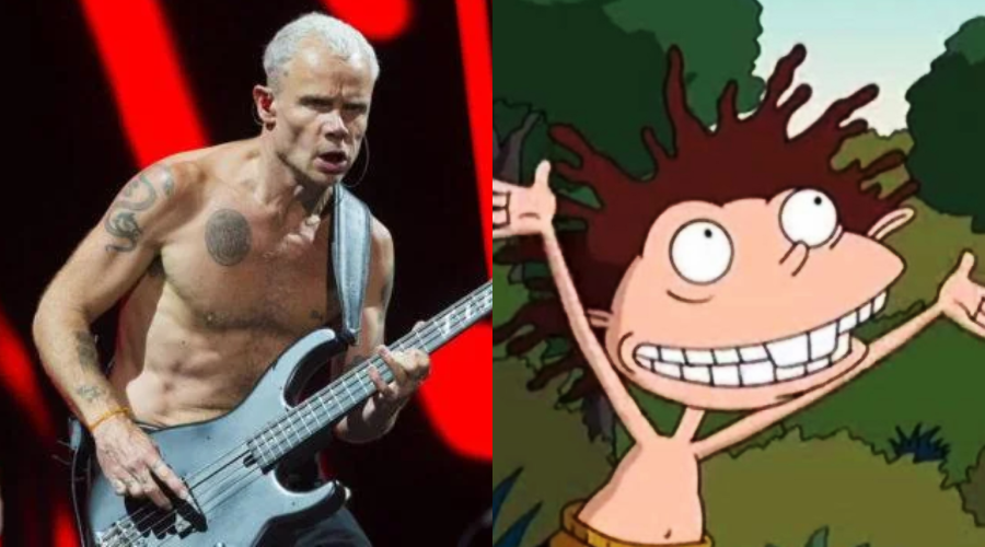 A shirtless man with a guitar performs on stage next to an animated character with spiky hair and wide eyes, standing outdoors with arms raised.