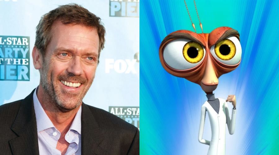 A man in a suit smiles at an event with a blue backdrop on the left; on the right is an animated character with large yellow eyes, orange face, and white lab coat against a blue background.