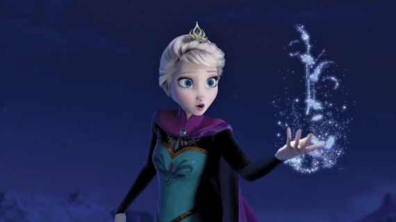 Animated character Elsa from "Frozen" stands outdoors at night, wearing a teal dress and purple cape, with a surprised expression as she creates sparkling ice magic from her hand.