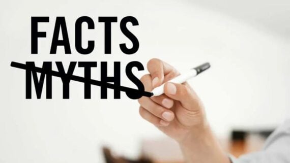 A hand holding a marker crosses out the word "MYTHS" and the word "FACTS" appears above it in bold black letters.