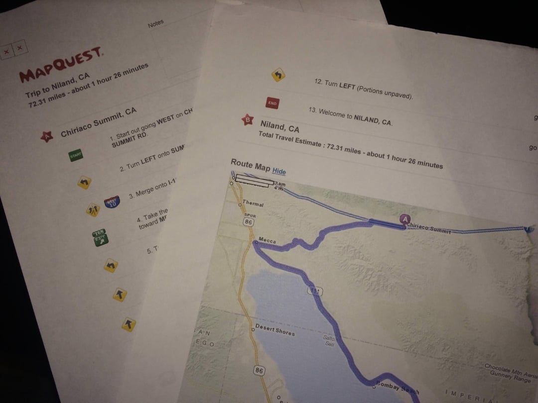 Two printed MapQuest pages show driving directions and a map route from Chiriaco Summit, CA to Niland, CA. The pages include step-by-step instructions with icons and a highlighted map showing the route near the Salton Sea.