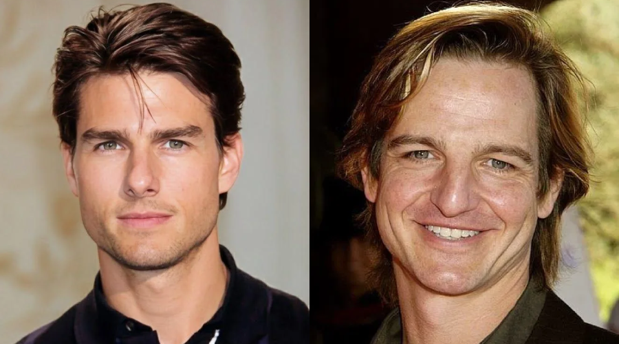 Side-by-side portraits of two men with light skin and brown hair, both smiling slightly. The man on the left has short, neatly styled hair, while the man on the right has longer hair and is smiling broadly.