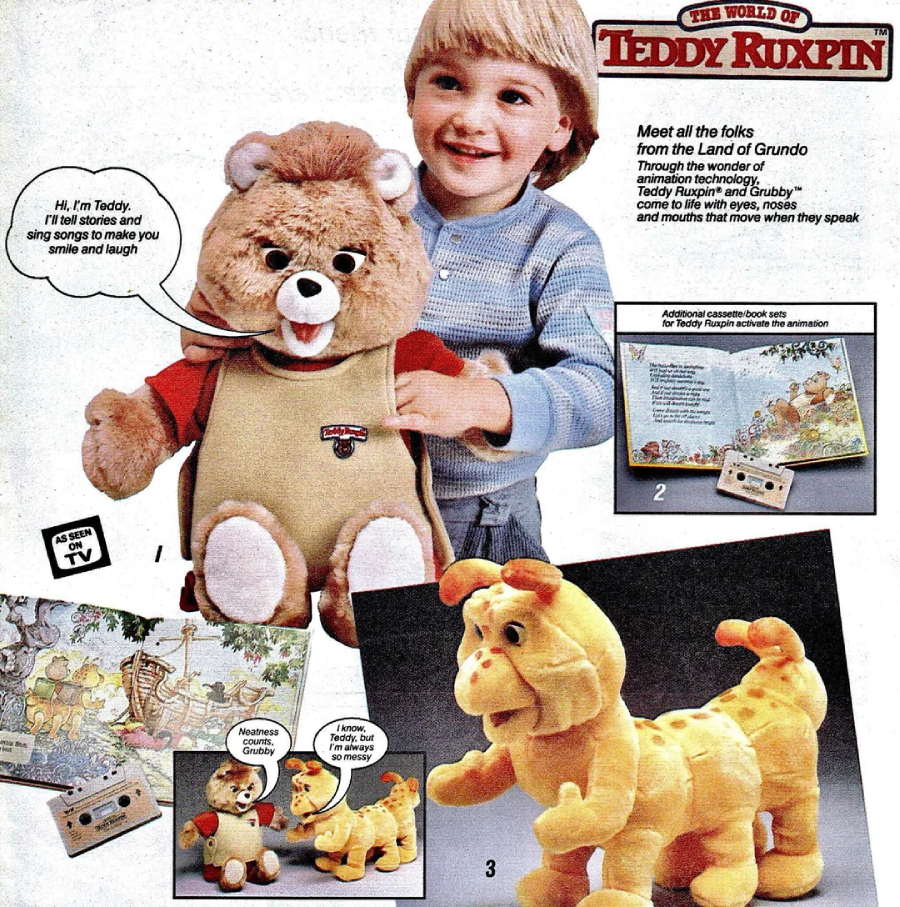 A young child smiles while playing with a Teddy Ruxpin bear. Nearby are a yellow Grubby toy, a storybook, and cassette tapes. Text explains that Teddy Ruxpin tells stories and sings songs.