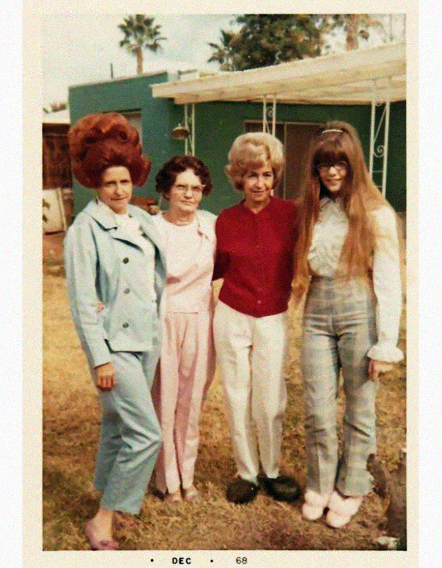 Four women stand together outside in front of a green building. They wear pastel 1960s outfits and have distinct hairstyles, including a large beehive and long straight hair. The photo is dated December 1968.