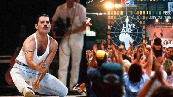 Queen performing at Live Aid in front of a massive crowd at Wembley Stadium