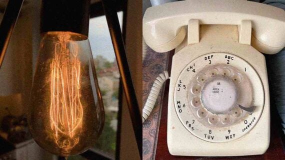 An old-fashioned light bulb and a vintage telephone representing everyday things from over 100 years ago