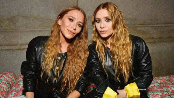 Mary-Kate and Ashley Olsen posing together at a public event