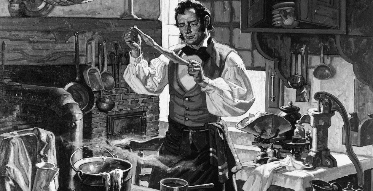 A man in old-fashioned clothes stands in a cluttered kitchen, examining a strip of dough over a steaming pot, surrounded by vintage kitchenware and utensils hanging on the wall.