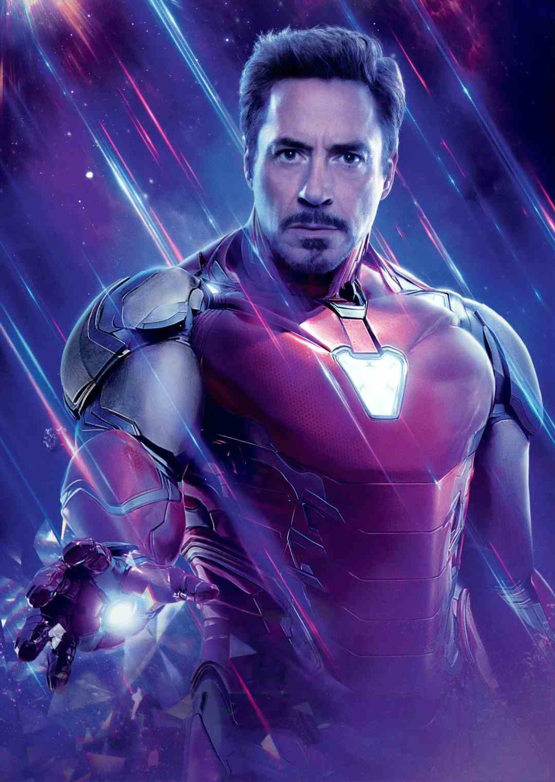 A man in a glowing red and gold armored suit stands with his palm facing forward, emitting light. He has short dark hair, a goatee, and a serious expression, set against a vibrant, streaked, purple-blue background.