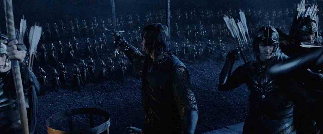 A group of archers in armor prepare to shoot arrows from a fortress wall at night, facing a massive army lined up in the darkness below.