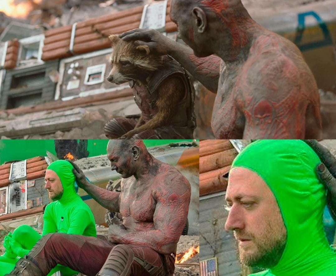 A split image shows a scene from a movie: a muscular, tattooed character gently pats a raccoon-like creature, with destroyed buildings in the background. Below, behind-the-scenes footage reveals actors in green suits filming the same scene.