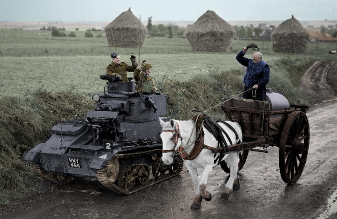 A World War II-era tank with soldiers is parked beside a rural road, as a man riding a horse-drawn water cart waves to them. Haystacks and fields are visible in the background under a cloudy sky.