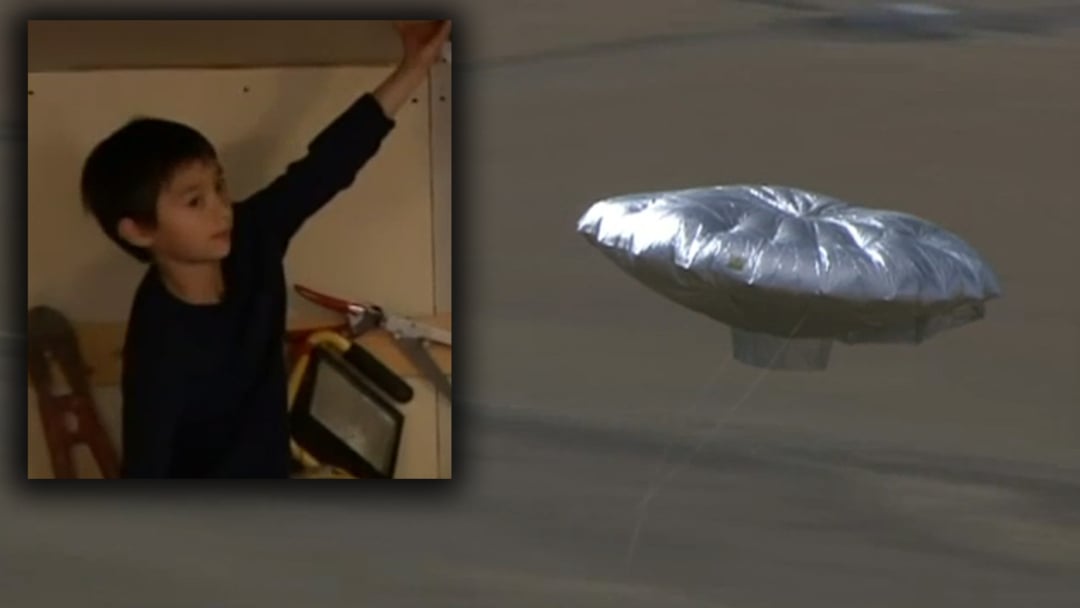 A composite image showing a young boy inside a small room on the left, and a silver, saucer-shaped helium balloon floating in the air on the right.