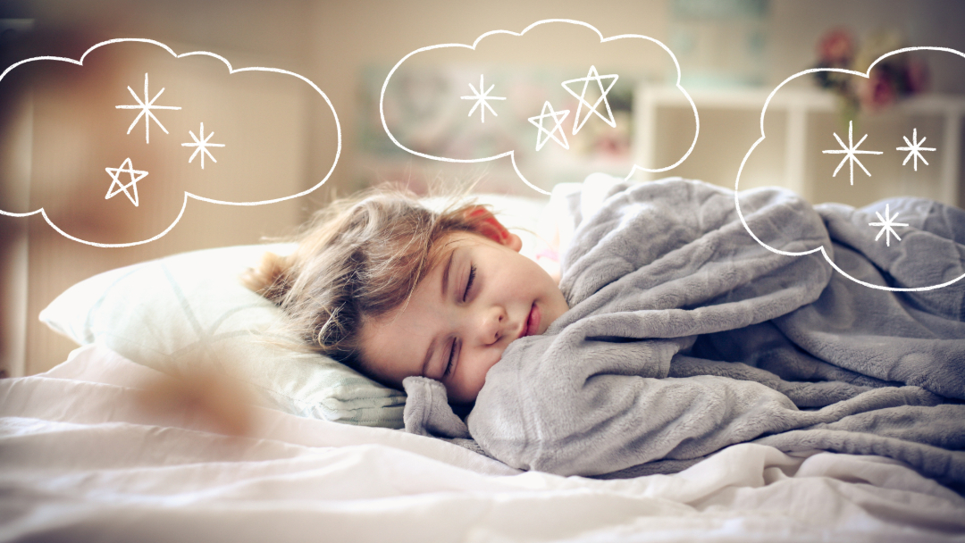 A young child sleeps peacefully in bed, wrapped in a gray blanket, with hand-drawn dream clouds above her head containing stars and sparkles. The scene appears cozy and imaginative.