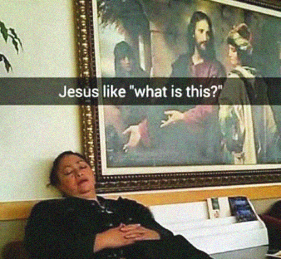 A woman sleeps on a bench below a painting of Jesus gesturing with his hand. The painting appears to be looking at her. Text on the image reads, “Jesus like ‘what is this?’”