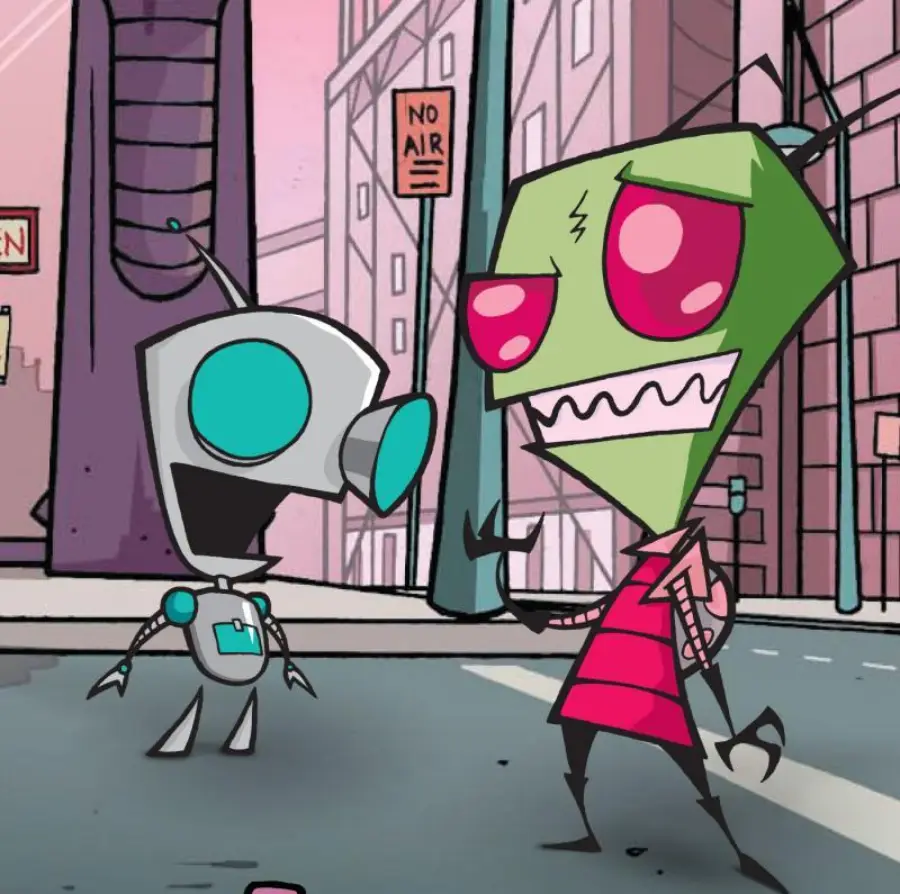 A green alien wearing a red outfit stands on a city street talking to a small robot with blue eyes. The background features tall pink buildings, street signs, and a mostly empty road.
