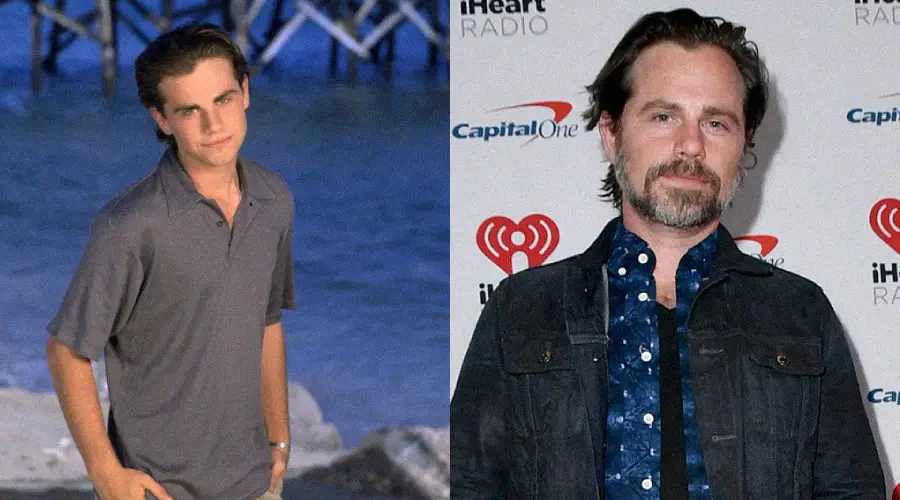 Side-by-side images show a young man with short dark hair standing on a beach, and an older man with dark hair and a beard posing at an event in front of a step-and-repeat backdrop.
