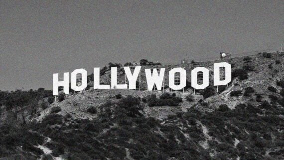 The Hollywood Sign shining above Los Angeles at night with a classic Old Hollywood atmosphere