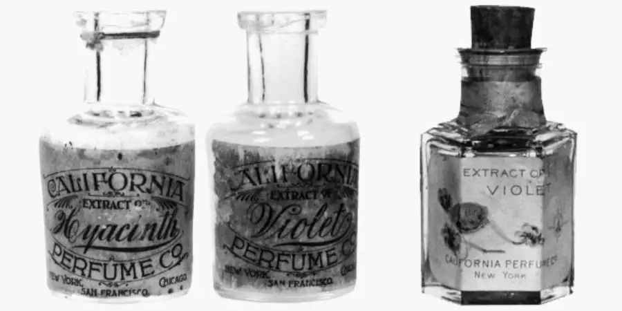 Three vintage glass perfume bottles with old-fashioned labels from the California Perfume Company, two round and one square, labeled "Hyacinth" and "Violet," displayed side by side.