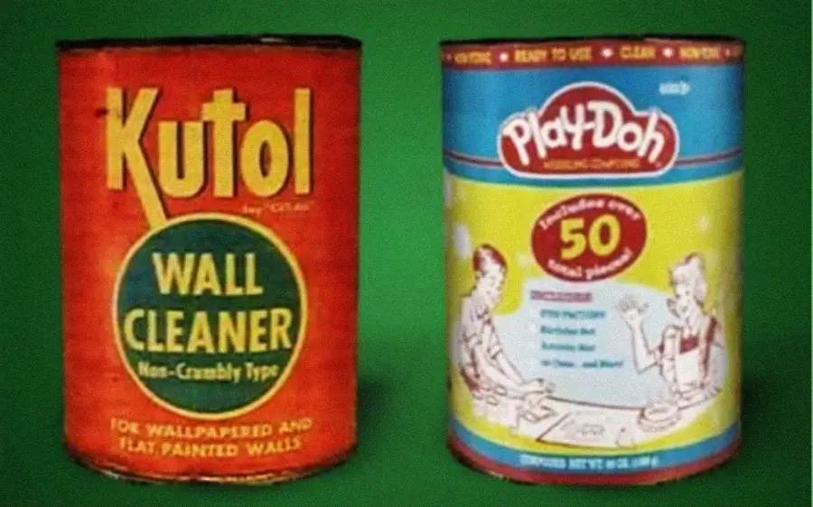 Two vintage cans are shown: a red Kutol Wall Cleaner can on the left, and a yellow-and-blue Play-Doh can on the right, featuring illustrations of children playing. Both are set against a green background.