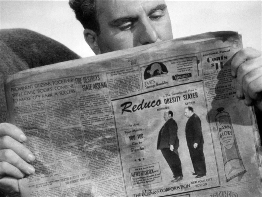 A person holds and reads a newspaper, focusing on an ad showing a man before and after weight loss, with the headline "Reduca Obesity Slayer" and various articles and ads visible on the page.