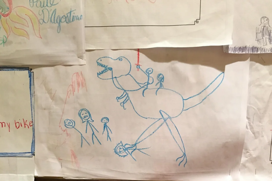 A child's crayon drawing of a large dinosaur carrying three stick-figure people on its back, with three more stick-figure people below, one appearing to be in the dinosaur's mouth. Other child drawings surround it.