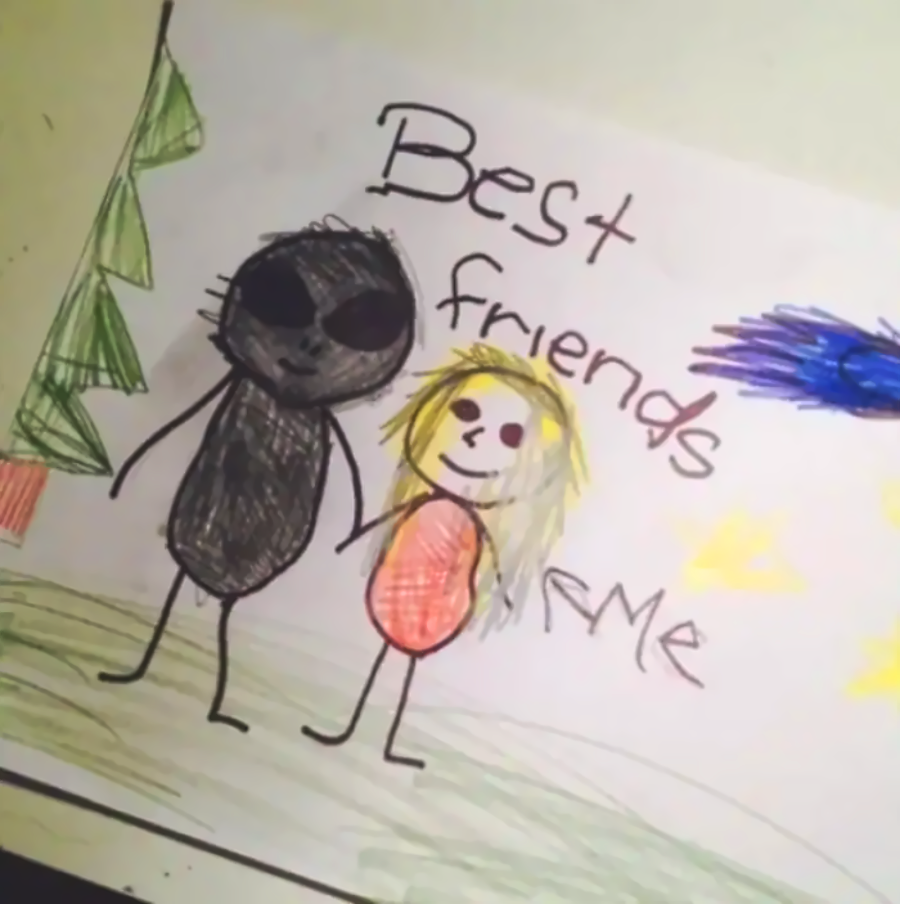 A child’s drawing shows a person holding hands with an alien. The words “Best friends” and “Me” are written on the paper. There are trees, grass, stars, and a blue shape in the background.