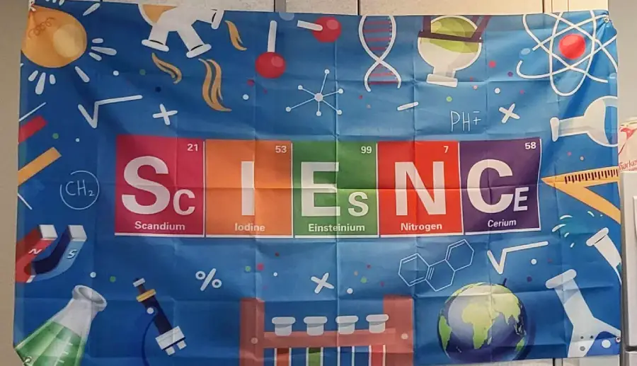 A colorful science-themed banner shows the word "SCIENCE" spelled with periodic table elements: Scandium, Iodine, Einsteinium, Nitrogen, and Cerium, surrounded by lab equipment, atoms, and science icons.