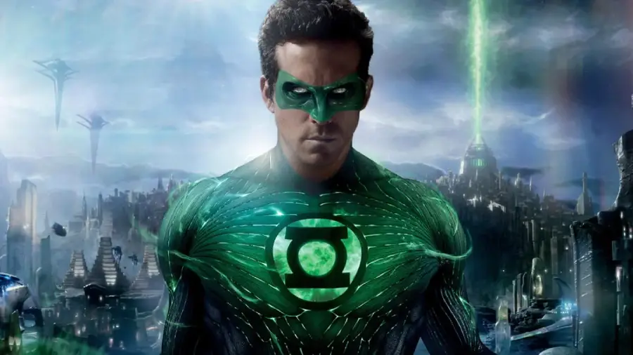 A man in a glowing green suit and mask with a circular green lantern symbol on his chest stands against a futuristic cityscape with bright green light beams in the sky.