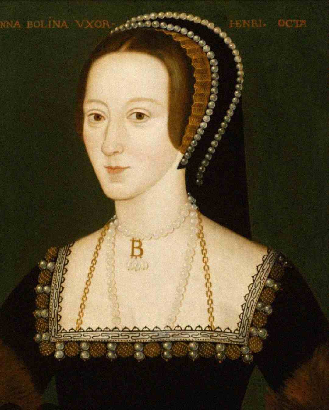 A painted portrait of a woman with pale skin and dark hair, wearing a black dress with gold and pearl trim, a pearl necklace with a “B” pendant, and a headdress adorned with pearls. Gold text is visible at the top.