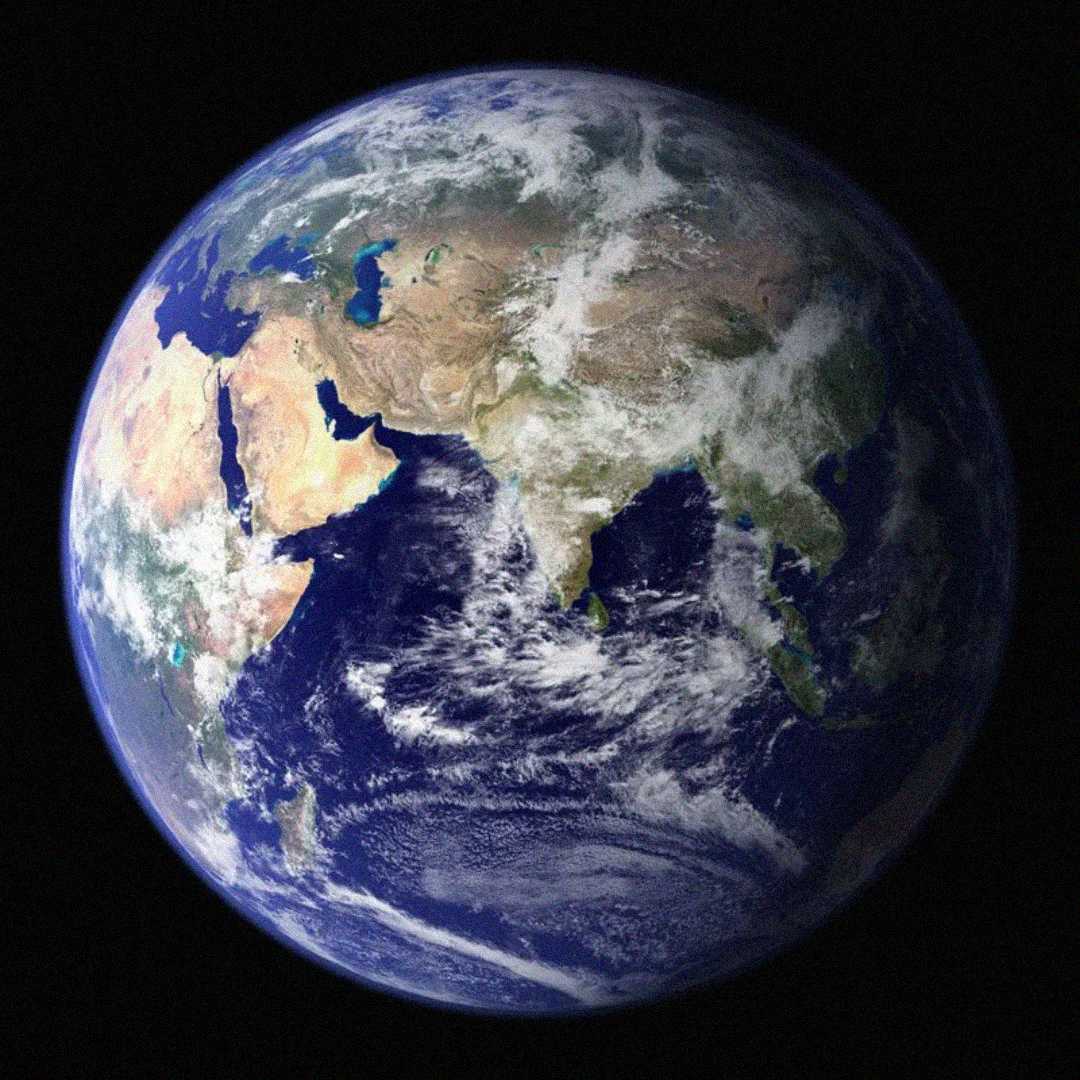 A view of Earth from space, showing parts of Africa, the Middle East, and Asia, with visible land, blue oceans, and swirling white clouds against a black background.