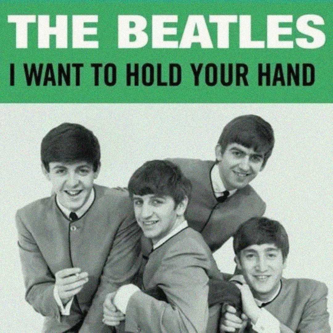 Four young men in matching suits smile and pose together in a black-and-white photo. Above them, green and white text reads: "THE BEATLES I WANT TO HOLD YOUR HAND.