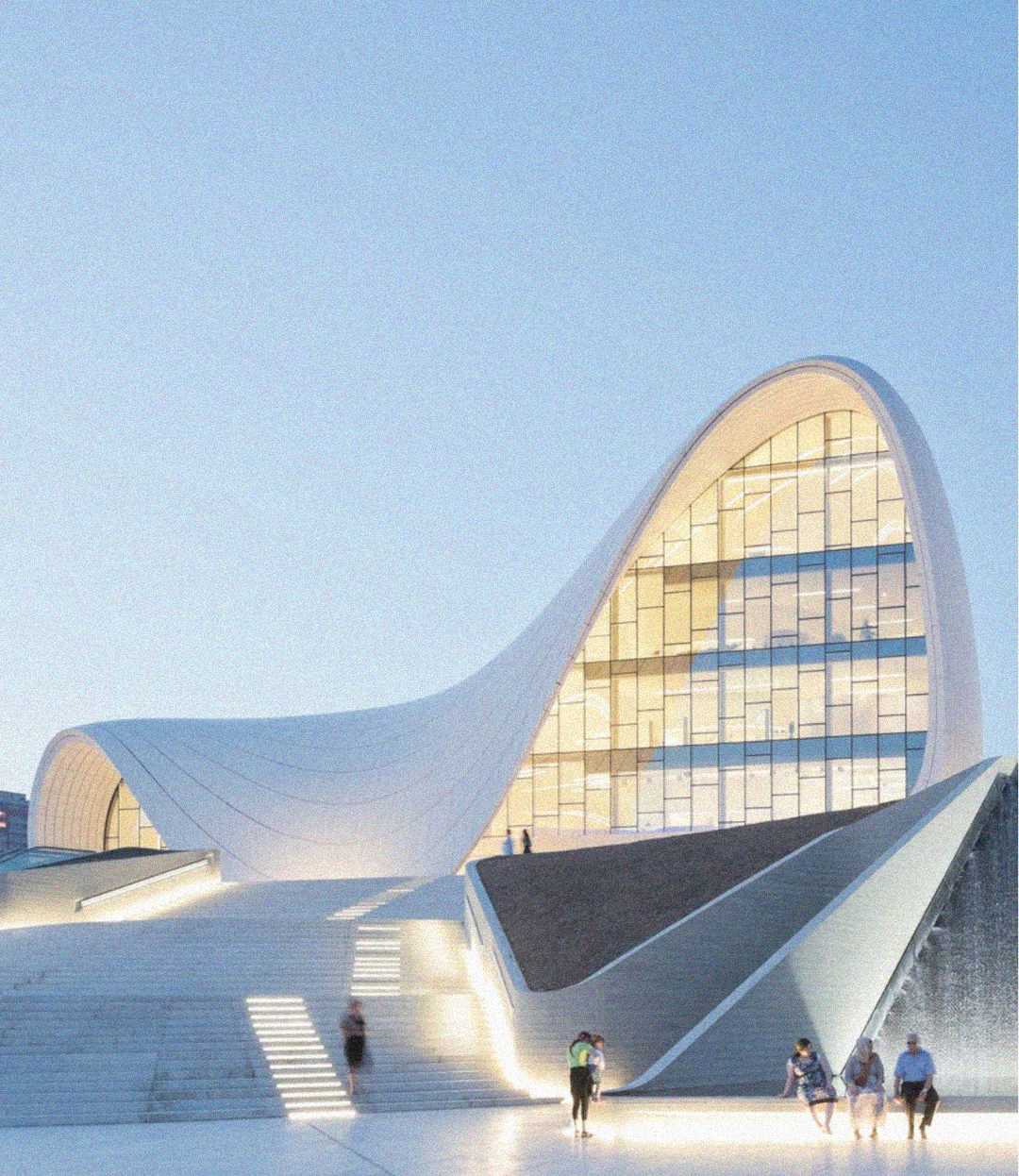 A modern building with flowing, curved white architecture and large glass windows is lit by daylight. Several people sit or walk nearby on wide steps leading up to the entrance.