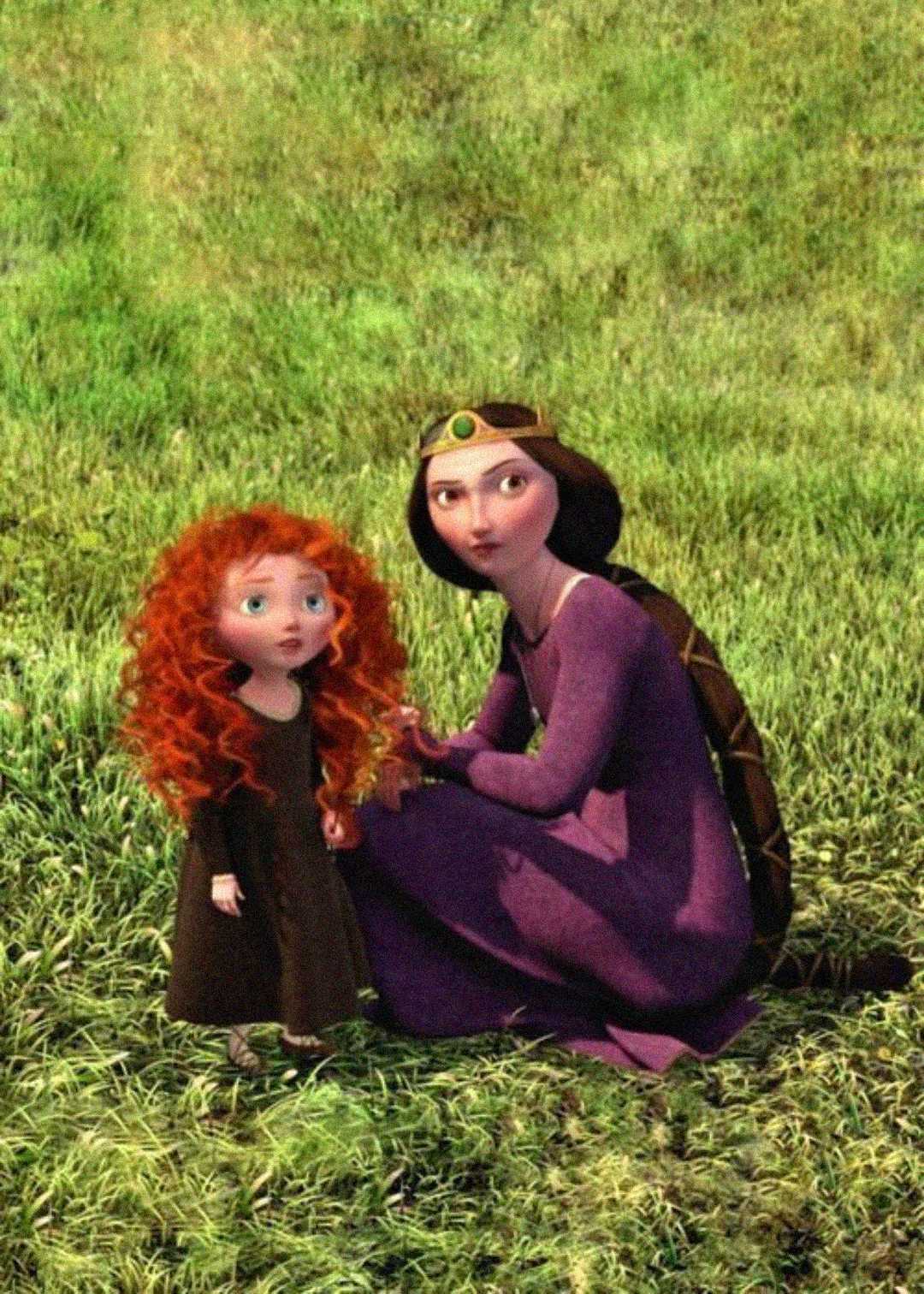 A young girl with curly red hair stands beside a woman in a purple dress and gold crown on green grass. The woman is kneeling and holding the girl's hand as they both look ahead.