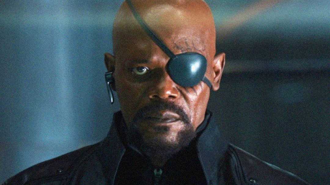 Samuel L. Jackson as Nick Fury wearing an eyepatch, with a serious expression, looking directly at the camera.