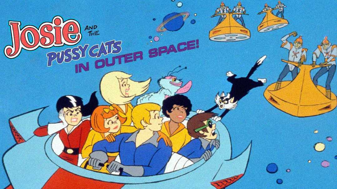 Animated band Josie and the Pussycats and their friends ride a spaceship with a cat in outer space. Alien characters chase them in yellow ships. The title reads "Josie and The Pussycats In Outer Space!