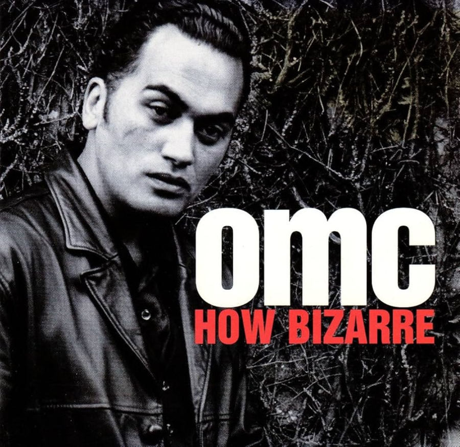 Black-and-white photo of a man in a leather jacket standing outside, with the text “omc” in large white letters and “HOW BIZARRE” in bold red letters overlaid at the bottom right.