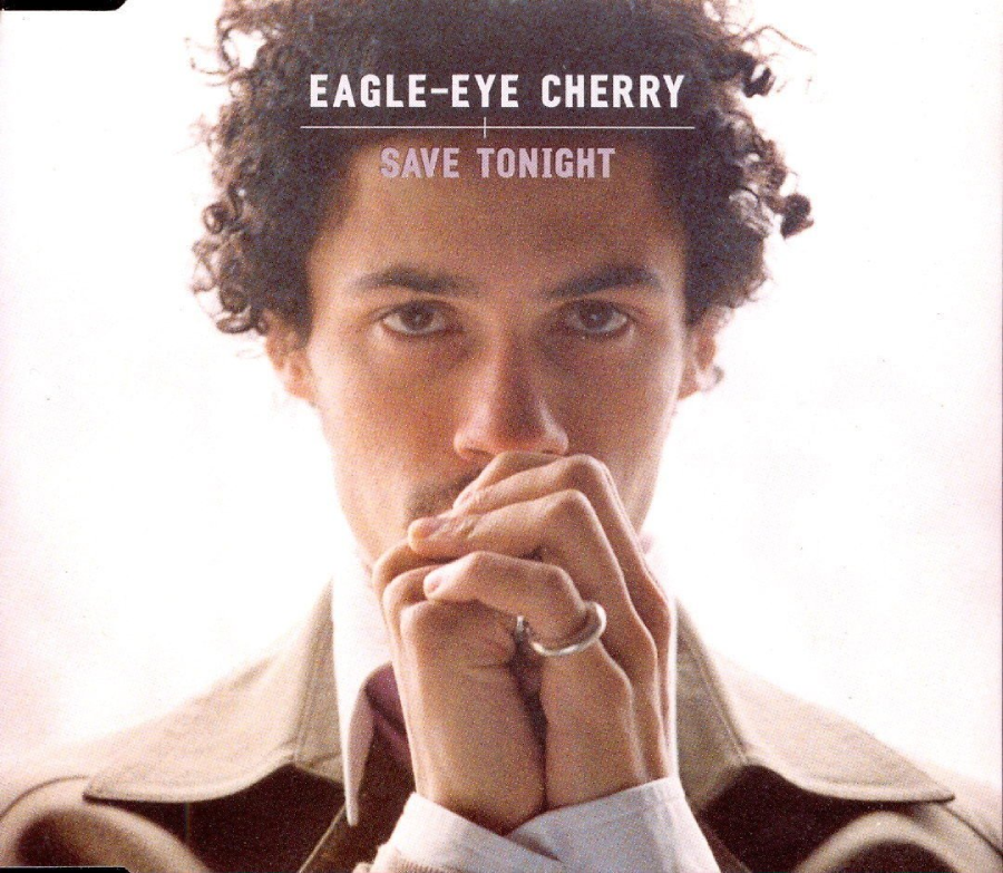 A person with curly hair stares intensely at the camera, hands clasped near their face. Text above reads "Eagle-Eye Cherry" and "Save Tonight" on a light background.