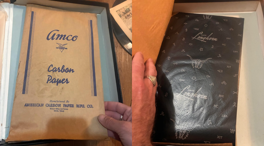 A hand holds a vintage brown envelope labeled "Amco Carbon Paper" on the left, and on the right, a hand lifts a sheet of black carbon paper decorated with white Western-themed symbols and the word "Longhorn.
