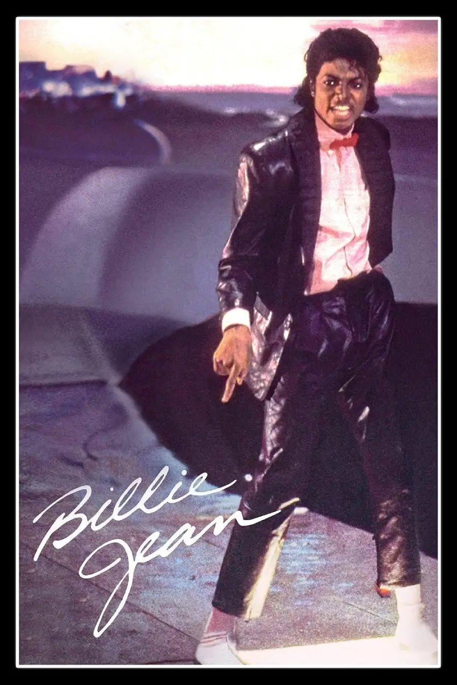 A person wearing a shiny black suit, pink shirt, white socks, and black shoes poses confidently on a dark-lit street with the signature "Billie Jean" written in white script at the bottom.