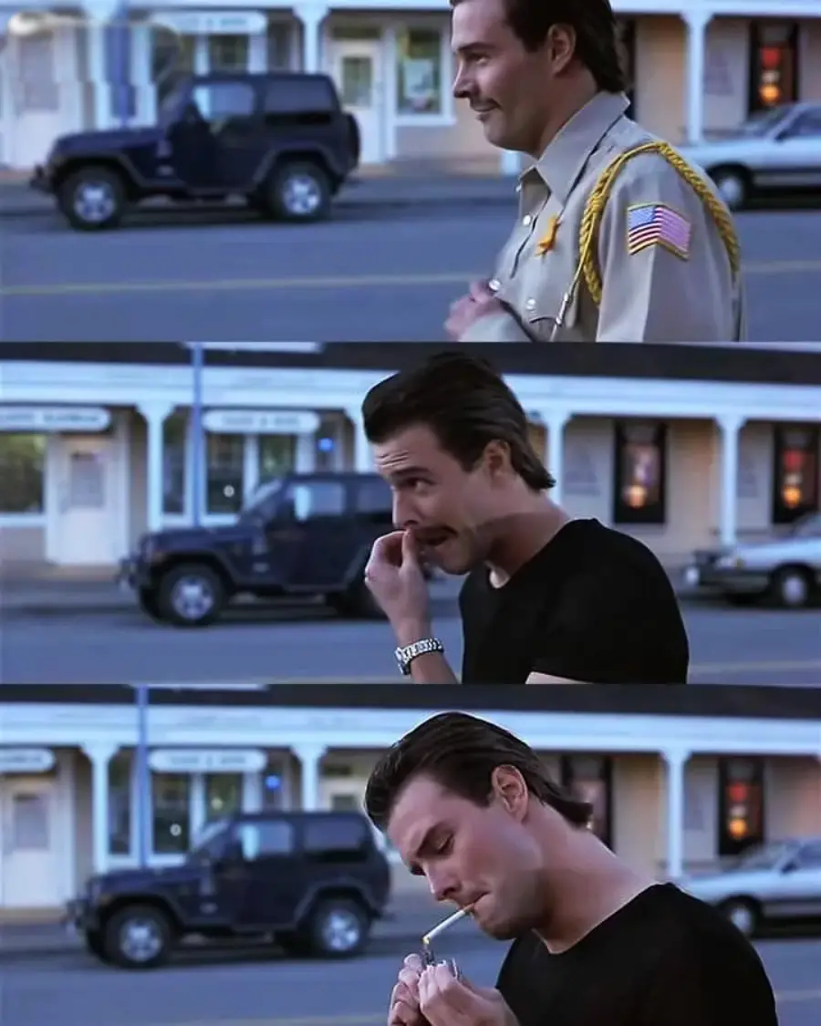 Three-panel image: A man in a sheriff's uniform talks to a man in a black t-shirt. The man in black picks his nose, then lights a cigarette, while standing on a street with cars and buildings in the background.