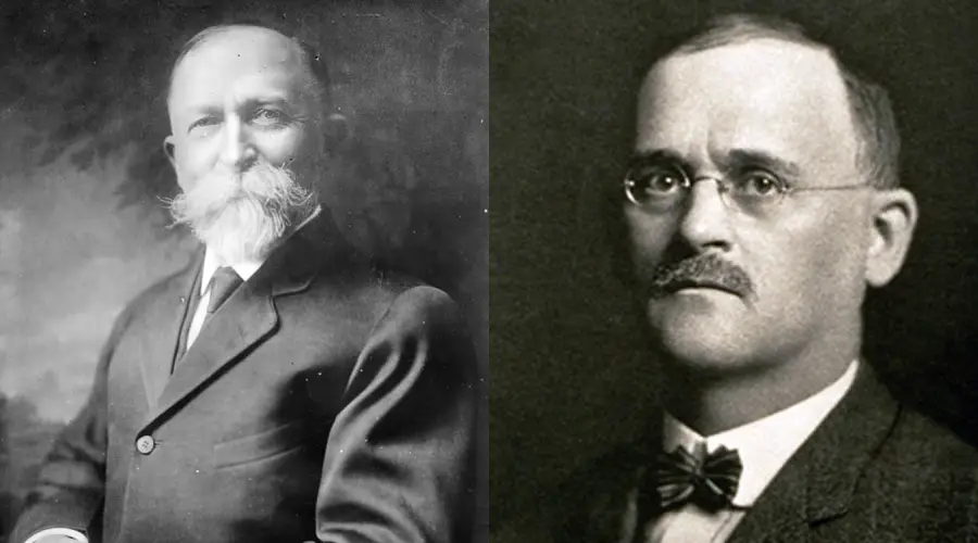 Two black-and-white portraits of men in suits; the man on the left has a large white beard and mustache, while the man on the right has glasses, a small mustache, and is clean-shaven.