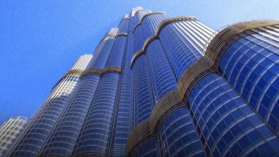 Burj Khalifa towering above Dubai skyline, appearing to defy gravity.