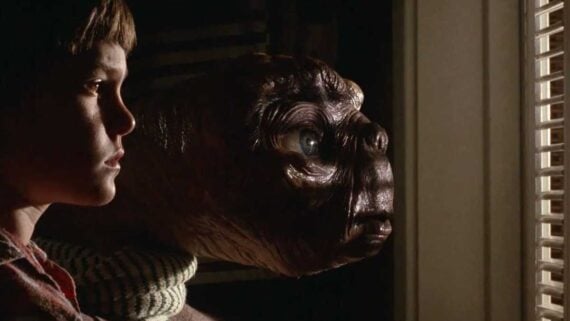 E.T. and Elliott in E.T. the Extra-Terrestrial, featuring the iconic quote &ldquo;E.T. phone home.&rdquo;